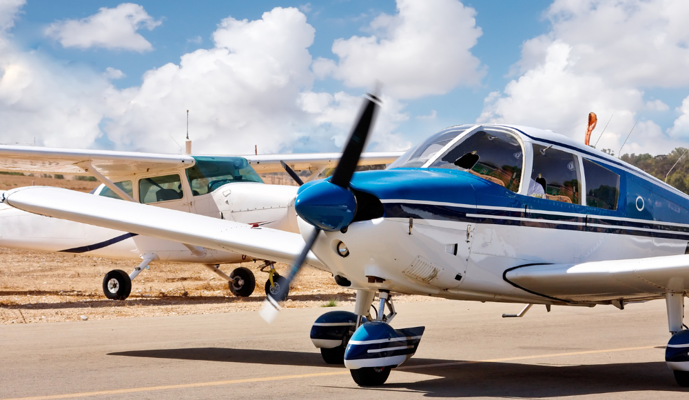 Two training aircraft on the runway, perfect for students pursuing their private pilot license.